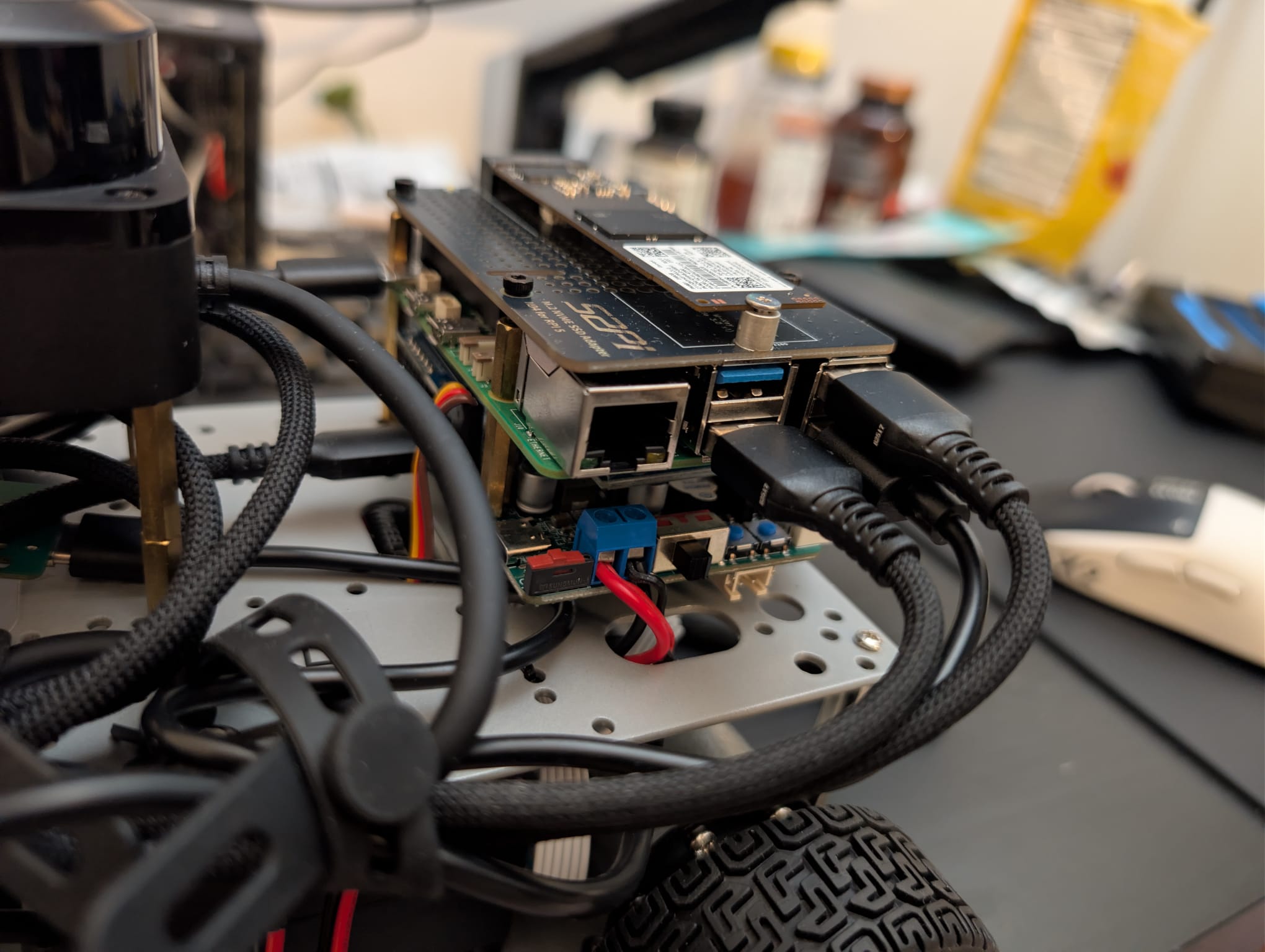 Raspberry Pi and Jetson edge-compute stack mounted on the Ackermann robot chassis